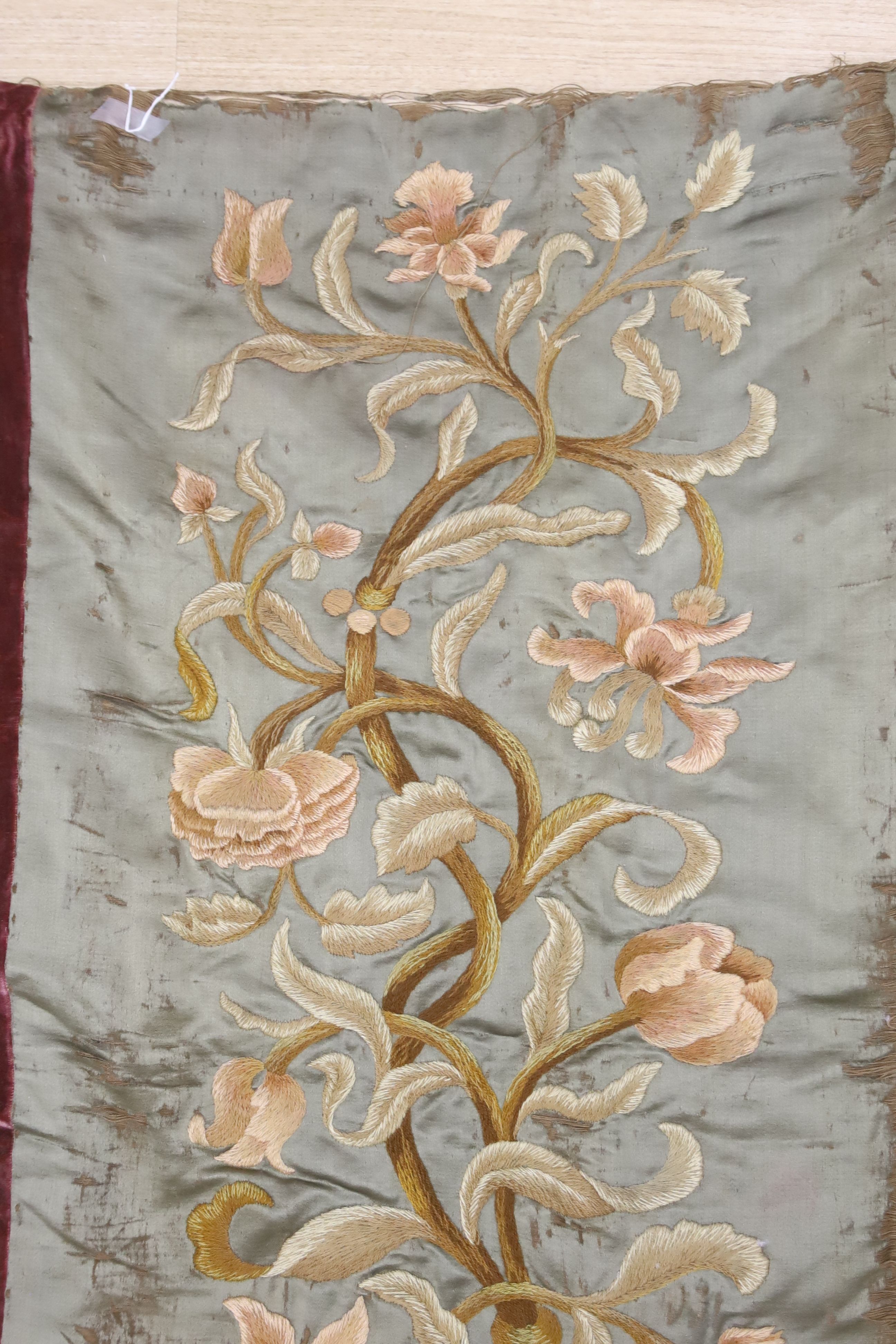 A crewel work hanging panel